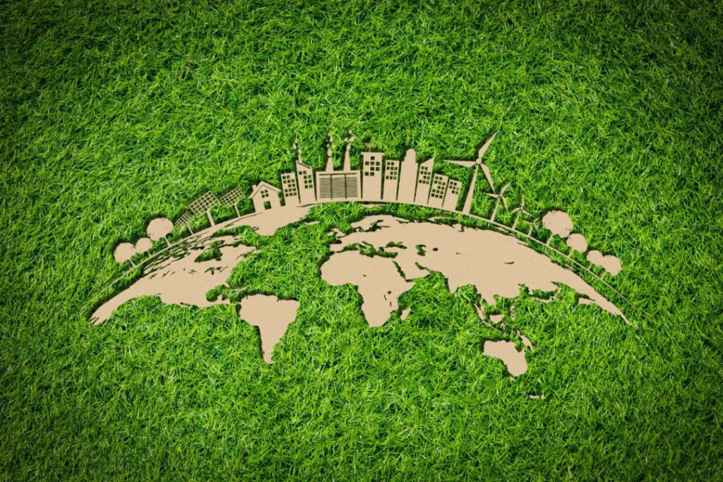 Mapa mundial inserido em uma grama para representar a transição verde